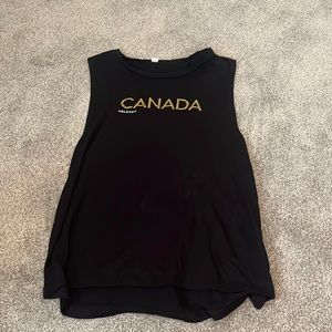 Peloton canada black tank top with gold and white lettering